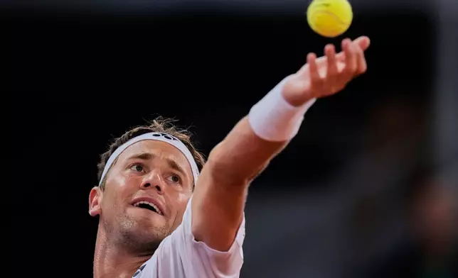 Casper Ruud of Norway serves against Francisco Cerundolo from Argentina during men's semifinal at the Madrid Open tennis tournament in Madrid, Spain, Friday, May 2, 2025. (AP Photo/Manu Fernandez)