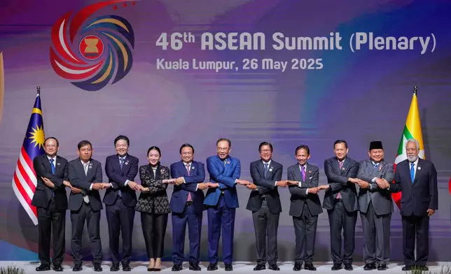 ASEAB leaders chain their hands while posing for a picture before the start of the plenary session at the Association of Southeast Asian Nations (ASEAN) Summit in Kuala Lumpur, Malaysia, Monday, May 26, 2025. From left to right, Laos's Prime Minister Sonexay Siphandone, Myanmar Permanent Secretary of the Ministry of Foreign Affairs Aung Kyaw Moe, Singapore's Prime Minister Lawrence Wong, Thailand's Prime Minister Paetongtarn Shinawatra, Vietnam's Prime Minister Pham Minh Chinh, Malaysia's Prime Minister Anwar Ibrahim, Philippine's President Ferdinand Marcos Jr., Brunei's Sultan Hassanal Bolkiah, Cambodian Prime Minister Hun Manet, Indonesia's President Prabowo Subianto and East Timor's Prime Minister Xanana Gusmao. (AP Photo/Vincent Thian)