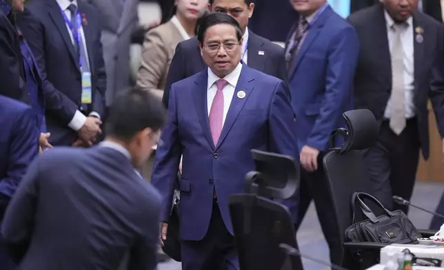 Vietnam's Prime Minister Pham Minh Chinh, center, arrives to attend the plenary session at the Association of Southeast Asian Nations (ASEAN) Summit in Kuala Lumpur, Malaysia, Monday, May 26, 2025. (AP Photo/Vincent Thian)