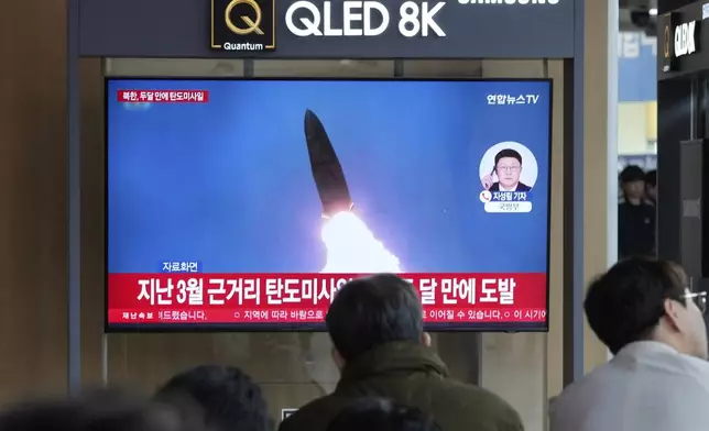 A TV screen shows a file image of North Korea's missile launch during a news program at Seoul Railway Station in Seoul, South Korea, Thursday, May 8, 2025. (AP Photo/Ahn Young-joon)