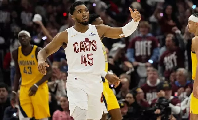 Cleveland Cavaliers guard Donovan Mitchell (45) gestures to the crowd during Game 1 in the Eastern Conference semifinals of the NBA basketball playoffs against the Indiana Pacers Sunday, May 4, 2025, in Cleveland. (AP Photo/Sue Ogrocki)