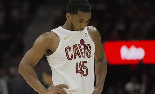 Cleveland Cavaliers guard Donovan Mitchell (45) chews on his jersey late in the second half during Game 1 in the Eastern Conference semifinals against the Indiana Pacers of the NBA basketball playoffs Sunday, May 4, 2025, in Cleveland. (AP Photo/Sue Ogrocki)