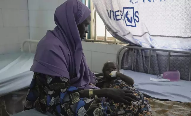 A malnourished child receives treatment at the Intersos facility, an Italian humanitarian organization, the only remaining facility providing in-patient services for malnutrition in Dikwa, northeastern, Nigeria, Tuesday, April 29, 2025. (AP Photo/Sunday Alamba)