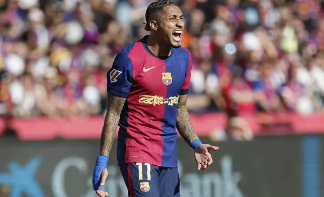 Barcelona's Raphinha reacts during the La Liga soccer match between Barcelona and Real Madrid in Barcelona, Spain, Sunday, May 11, 2025. AP Photo/Joan Monfort)