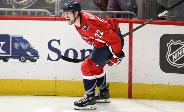 Washington Capitals right wing Brandon Duhaime (22) celebrates his empty net goal in the third period of Game 5 of a first-round NHL hockey playoff series against the Montreal Canadiens Wednesday, April 30, 2025, in Washington. (AP Photo/Nick Wass)