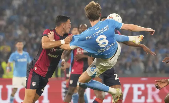 Napoli's Scott McTominay scores his side's first goal during the Italian Serie A soccer match between Napoli and Cagliari at the Diego Maradona stadium in Naples, Italy, Friday, May 23, 2025. (AP Photo/Gregorio Borgia)