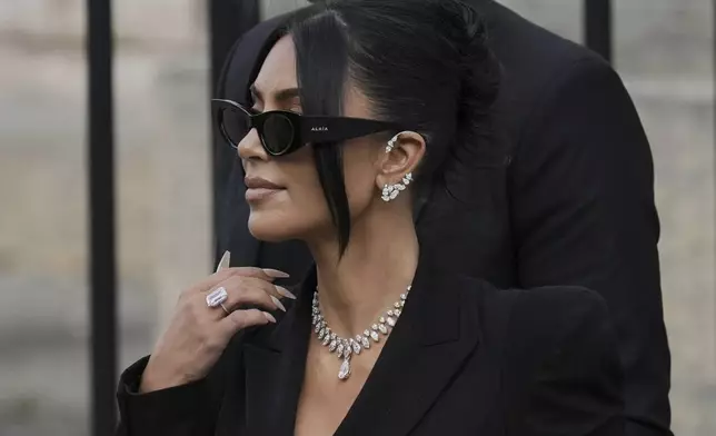 Kim Kardashian leaves the justice palace after testifying, regarding a robbery of millions of dollars in jewels from her Paris hotel room in 2016, in Paris, Tuesday, May 13, 2025. (AP Photo/Aurelien Morissard)