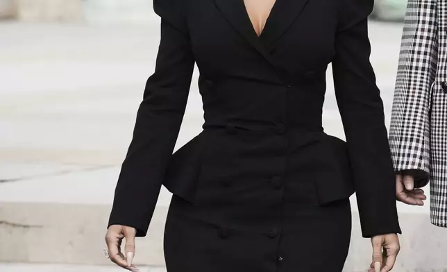 Kim Kardashian leaves the justice palace after testifying, regarding a robbery of millions of dollars in jewels from her Paris hotel room in 2016, in Paris, Tuesday, May 13, 2025. (AP Photo/Aurelien Morissard)