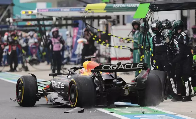Red Bull driver Max Verstappen of the Netherlands reacts to damages during the Sprint race at the Miami Formula One Grand Prix at the International Autodrome, Saturday, May 3, 2025, in Miami Gardens, Fla. (Shawn Thew/Pool Photo via AP)