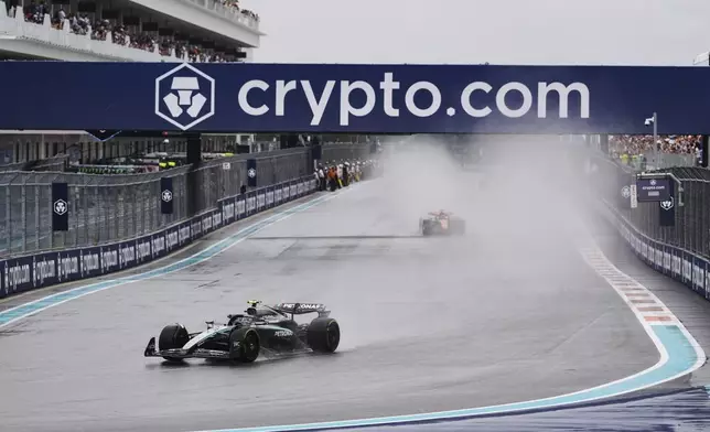 Drivers participate in a safety car lap before the Sprint race at the Formula One Miami Grand Prix auto race, Saturday, May 3, 2025, in Miami Gardens, Fla. (AP Photo/Rebecca Blackwell)
