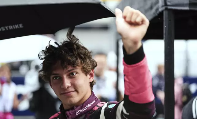 Mercedes driver Kimi Antonelli of Italy greets fans before the Sprint race at the Formula One Miami Grand Prix auto race, Saturday, May 3, 2025, in Miami Gardens, Fla. (AP Photo/Rebecca Blackwell)