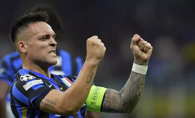 Inter Milan's Lautaro Martinez celebrates after scoring his side's opening goal during the Champions League semifinal second leg soccer match between Inter Milan and Barcelona at San Siro stadium in Milan , Italy, Tuesday, May 6, 2025.. (Spada/LaPresse via AP)