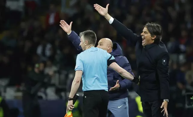 Inter Milan's head coach Simone Inzaghi shouts out as gives instructions from the side line during the Champions League semifinal first leg soccer match between Barcelona and Inter Milan at the Lluis Companys Olympic Stadium in Barcelona, Spain, Wednesday, April 30, 2025. (AP Photo/Joan Monfort)