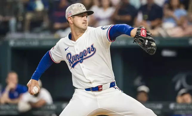 Texas Rangers' Tyler Mahle pitches during the first inning of a baseball game against the Houston Astros, Saturday, May 17, 2025, in Arlington, Texas. (AP Photo/Jessica Tobias)
