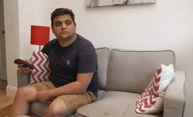 Spencer Goidel, an Equal Employment Opportunity Specialist with the Internal Revenue Service who was notified his job would be eliminated as part of the government's efficiency cuts, sits for a portrait in his home in Boca Raton, Fla., April 16, 2025. (AP Photo/Daniel Kozin)