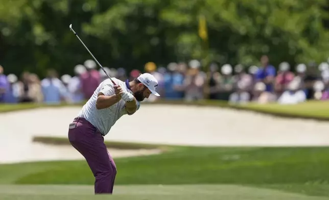 Jon Rahm, of Spain, hits from the fairway on the fifth hole during the third round of the PGA Championship golf tournament at the Quail Hollow Club, Saturday, May 17, 2025, in Charlotte, N.C. (AP Photo/Matt York)