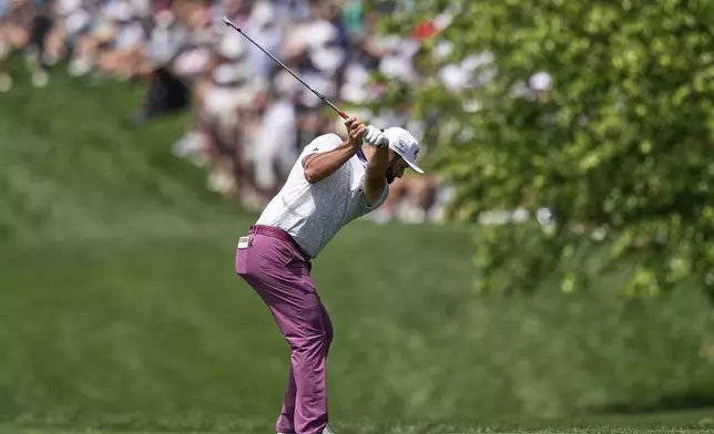 Jon Rahm, of Spain, hits from the fairway on the first hole during the third round of the PGA Championship golf tournament at the Quail Hollow Club, Saturday, May 17, 2025, in Charlotte, N.C. (AP Photo/David J. Phillip)