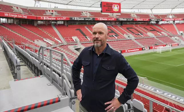 Erik ten Hag poses during his presentation as new head coach of Bundesliga soccer club Bayer 04 Leverkusen at the BayArena stadium in Leverkusen, Germany, Monday, May 26, 2025. (AP Photo/Martin Meissner)
