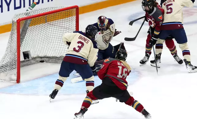 Ottawa Charge's Mannon McMahon (18) scores on Montreal Victoire goaltender Ann-Renee Desbiens (35) past Cayla Barnes (3), during third period PWHL playoff hockey action in Ottawa, Ontario, Tuesday, May 13, 2025. (Justin Tang/The Canadian Press via AP)