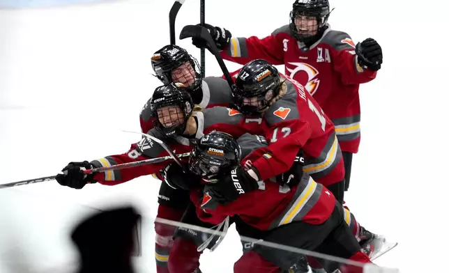 Ottawa Charge's Mannon McMahon (18) celebrates her goal against the Montreal Victoire with teammates, during third period PWHL playoff hockey action in Ottawa, Ontario, Tuesday, May 13, 2025. (Justin Tang/The Canadian Press via AP)