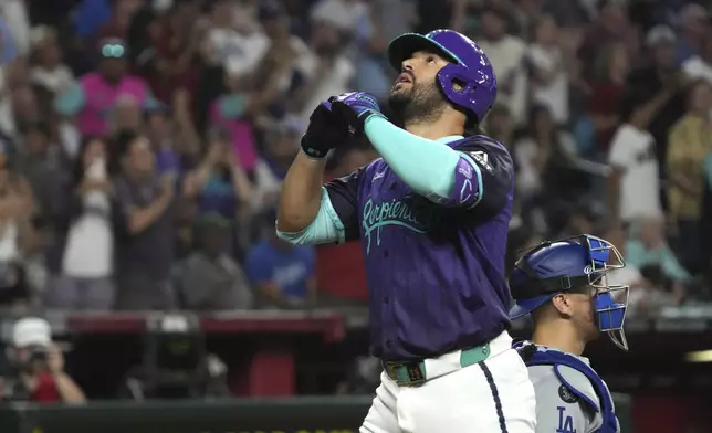 Arizona Diamondbacks' Eugenio Suárez reacts after hitting a solo home run against the Los Angeles Dodgers in the sixth inning during a baseball game, Saturday, May 10, 2025, in Phoenix. (AP Photo/Rick Scuteri)