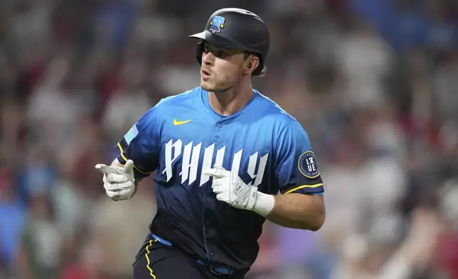 Philadelphia Phillies' Max Kepler reacts after hitting a home run against Arizona Diamondbacks pitcher José Castillo during the seventh inning of a baseball game, Friday, May 2, 2025, in Philadelphia. (AP Photo/Matt Slocum)