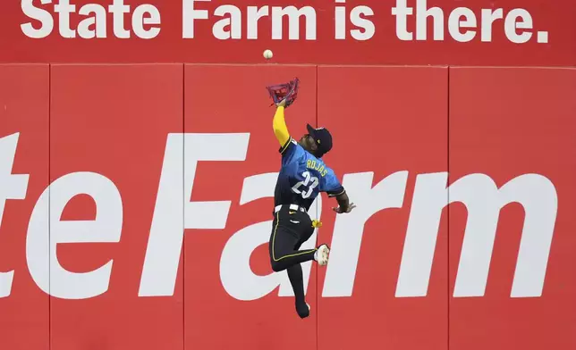 Philadelphia Phillies center fielder Johan Rojas catches a fly out by Arizona Diamondbacks' Lourdes Gurriel Jr. during the ninth inning of a baseball game, Friday, May 2, 2025, in Philadelphia. (AP Photo/Matt Slocum)
