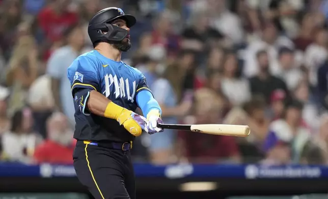 Philadelphia Phillies' Kyle Schwarber watches after hitting a home run against Arizona Diamondbacks pitcher José Castillo during the seventh inning of a baseball game, Friday, May 2, 2025, in Philadelphia. (AP Photo/Matt Slocum)