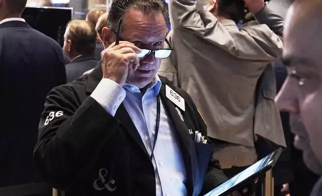 Trader Edward Curran works on the floor of the New York Stock Exchange, Friday, May 2, 2025. (AP Photo/Richard Drew)