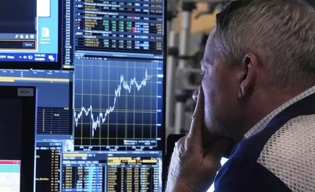 Trader Rob Taylor works on the floor of the New York Stock Exchange, Friday, May 2, 2025. (AP Photo/Richard Drew)