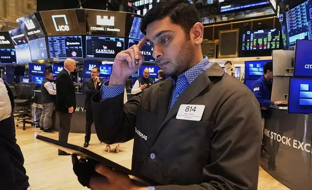 Trader Niall Pawa works on the floor of the New York Stock Exchange, Friday, May 2, 2025. (AP Photo/Richard Drew)