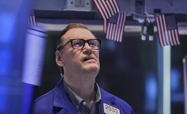 Specialist Patrick King works on the floor of the New York Stock Exchange, Friday, May 2, 2025. (AP Photo/Richard Drew)