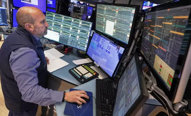 Specialist James Denaro works at his post on the floor of the New York Stock Exchange, Thursday, May 1, 2025. (AP Photo/Richard Drew)