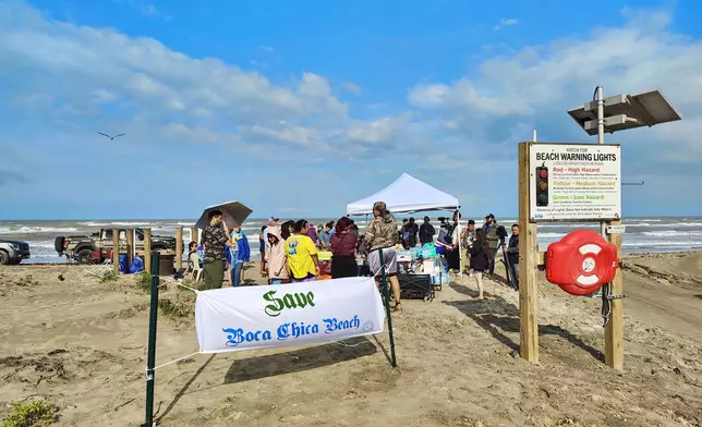 People protest at Boca Chica beach, Texas, on Saturday afternoon, May 3, 2025, before an incorporation election that would turn Starbase into an official Texas city. (Miguel Roberts/The Brownsville Herald via AP)