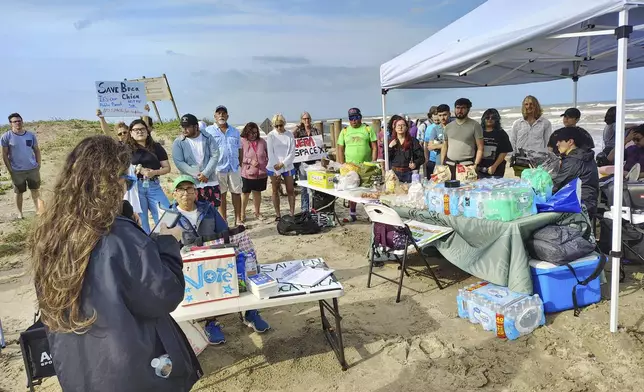 People protest at Boca Chica beach, Texas, on Saturday, May 3, 2025, before an incorporation election that would turn Starbase into an official Texas city. (Miguel Roberts/The Brownsville Herald via AP)