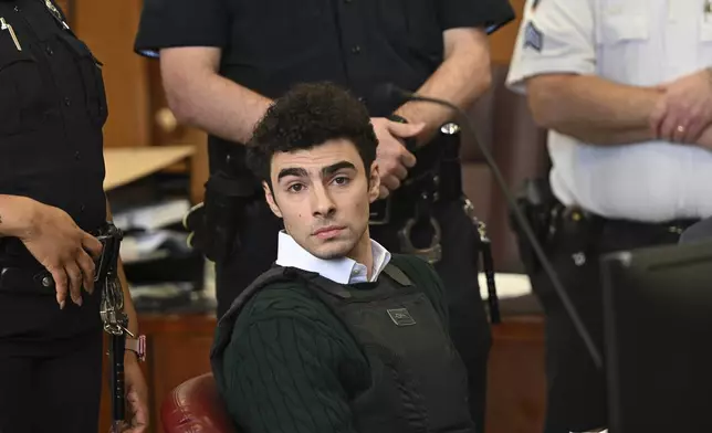 FILE - Luigi Mangione, accused of fatally shooting Brian Thompson, the CEO of UnitedHealthcare, appears in Manhattan state court in New York, Friday, Feb. 21, 2025. (Curtis Means/Pool Photo via AP, File