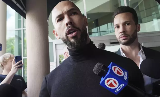 FILE - Influencer brothers Andrew and Tristan Tate arrive, Thursday, Feb. 27, 2025, in Fort Lauderdale, Fla. (AP Photo/Marta Lavandier, File)