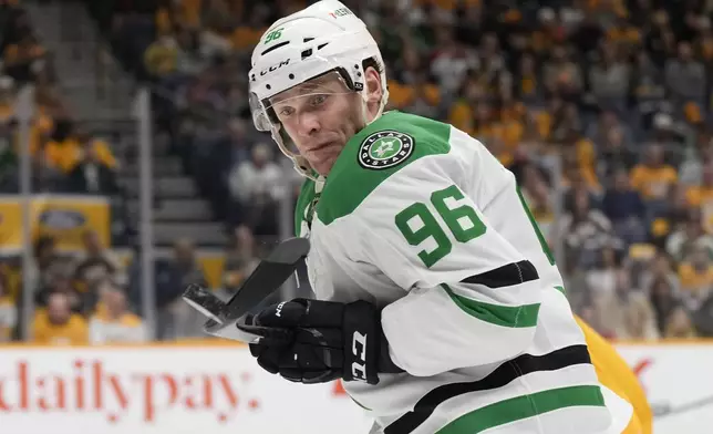 Dallas Stars right wing Mikko Rantanen (96) chases the puck during the first period of an NHL hockey game against the Nashville Predators, Wednesday, April 16, 2025, in Nashville, Tenn. (AP Photo/George Walker IV)