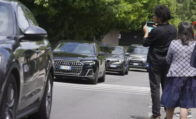 Iranian delegates arrive at the Omani Embassy in Rome for closed-door meeting with an U.S. delegation to discuss Tehran's rapidly advancing nuclear program, Friday, May 23, 2025. (AP Photo/Andrew Medichini)
