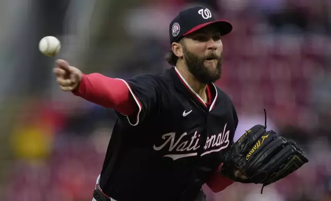 Washington Nationals pitcher Trevor Williams throws during the first inning of a baseball game against the Cincinnati Reds, Saturday, May 3, 2025, in Cincinnati. (AP Photo/Carolyn Kaster)