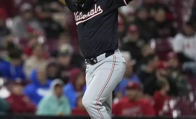 Washington Nationals' Amed Rosario celebrates as he rounds the the bases after hitting a three-run home run in the sixth inning of a baseball game against the Cincinnati Reds, Saturday, May 3, 2025, in Cincinnati. (AP Photo/Carolyn Kaster)