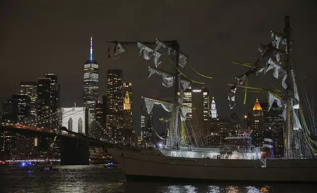 A masted Mexican Navy training ship, the Cuauhtémoc, sits stranded after colliding with the Brooklyn Bridge, Saturday, May 17, 2025, in New York. (AP Photo/Yuki Iwamura)
