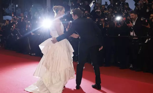 Jennifer Lawrence, left, and Robert Pattinson pose for photographers upon arrival at the premiere of the film 'Die, My Love' at the 78th international film festival, Cannes, southern France, Saturday, May 17, 2025. (Photo by Joel C Ryan/Invision/AP)