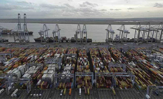 FILE - Shipping containers wait to be processed at London Gateway port, in Stanford-le-Hope, on the Thames estuary east of London, England, Wednesday, Feb. 5, 2025. (AP Photo, File)