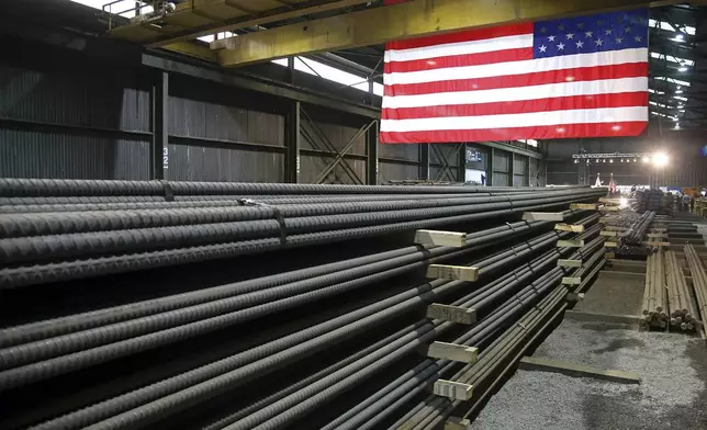 FILE - Steel rods produced at the Gerdau Ameristeel mill in St. Paul, Minn., await shipment, May 9, 2019. (AP Photo/Jim Mone, File)
