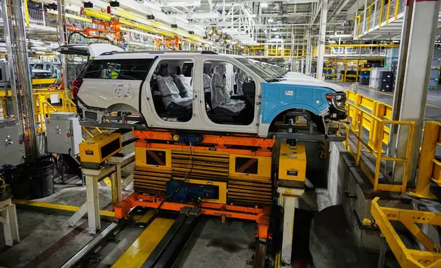 A 2025 Ford Expedition moves on an assembly line during a media tour to launch the 2025 Ford Expedition at the Ford Motor Company Kentucky Truck Plant, Wednesday, April 30, 2025, in Louisville, Ky. (AP Photo/Carolyn Kaster)