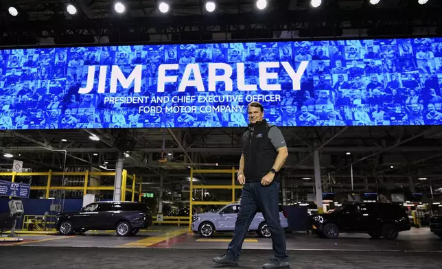 Jim Farley, President and Chief Executive Officer of Ford, arrives on stage to speak at the Ford Motor Company Kentucky Truck Plant to launch the 2025 Ford Expedition, Wednesday, April 30, 2025, in Louisville, Ky. (AP Photo/Carolyn Kaster)