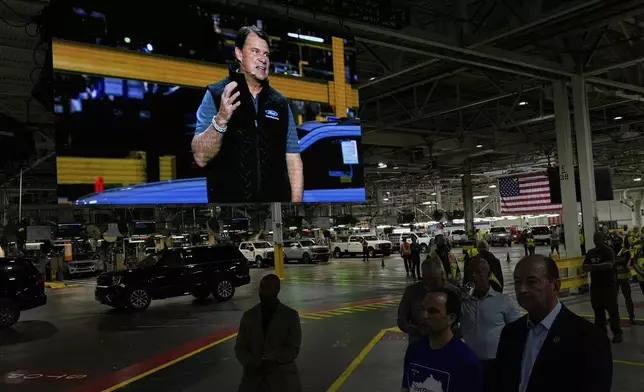 Jim Farley, President and Chief Executive Officer of Ford, is seen on a large monitor as he speaks at the Ford Motor Company Kentucky Truck Plant to launch the 2025 Ford Expedition, Wednesday, April 30, 2025, in Louisville, Ky. (AP Photo/Carolyn Kaster)