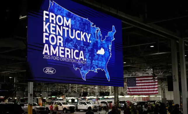 Workers gather at the Ford Motor Company Kentucky Truck Plant for the 2025 Ford Expedition launch, Wednesday, April 30, 2025, in Louisville, Ky. (AP Photo/Carolyn Kaster)