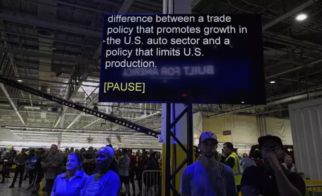 A scrolling teleprompter for Jim Farley, President and Chief Executive Officer of Ford, is seen as he speaks at the Ford Motor Company Kentucky Truck Plant about trade policy during the launch of the 2025 Ford Expedition, Wednesday, April 30, 2025, in Louisville, Ky. (AP Photo/Carolyn Kaster)